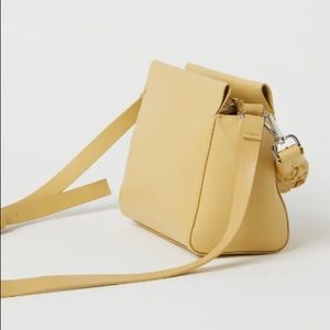 Light yellow H&M crossbody handbag with braided handle
